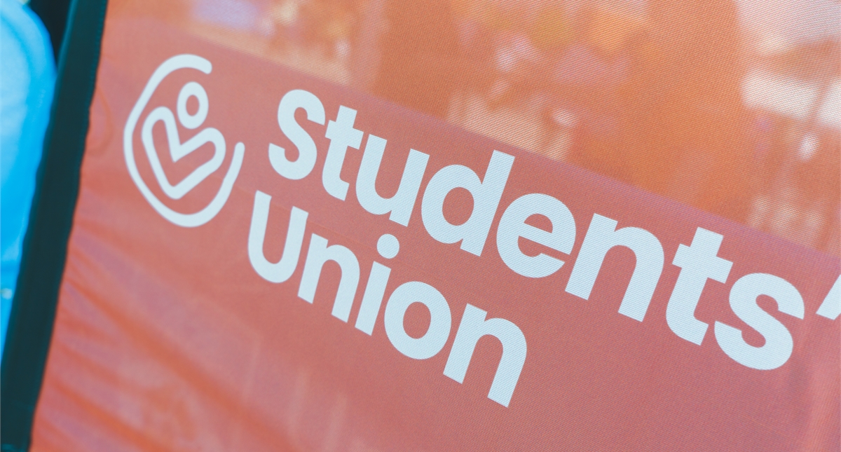 Student Union Logo in white with an orange background